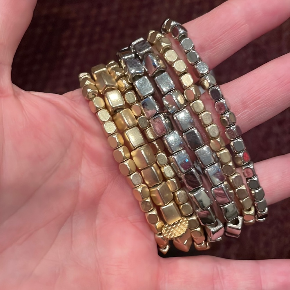 Set of silver and gold tone bracelets